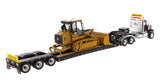 1:50 International HX520 Tandem Tractor + XL 120 Trailer, Black w/ Cat® 963K Track loader loaded including both rear boosters, Transport Series, 85599 RETIRING SOON