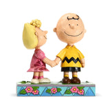 Sally holding Charlie Brown hand