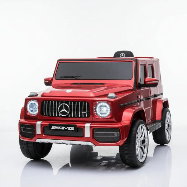 Red toy car with Mercedes-Benz logo on a white background