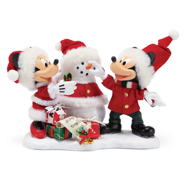 Minnie adds the final touch of holly leaves on hers and Mickey's Snow Santa. The gifts are for all their special friends.