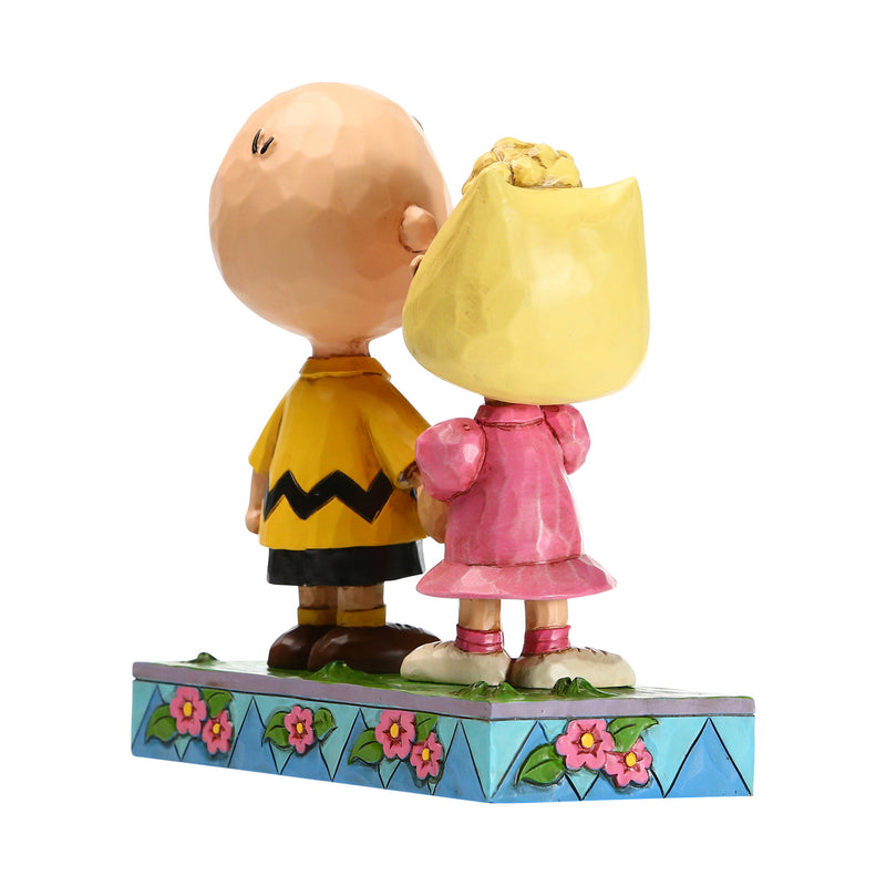Sally holding Charlie Brown hand 