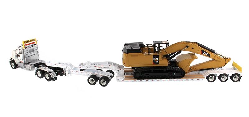 1:50 International HX520 Tandem Tractor + XL 120 Trailer outriggers, White w/ Cat®349F L XE Hydraulic Excavator loaded including both rear boosters and front jeep, Transport Series, 85600 ***INCOMING MAY